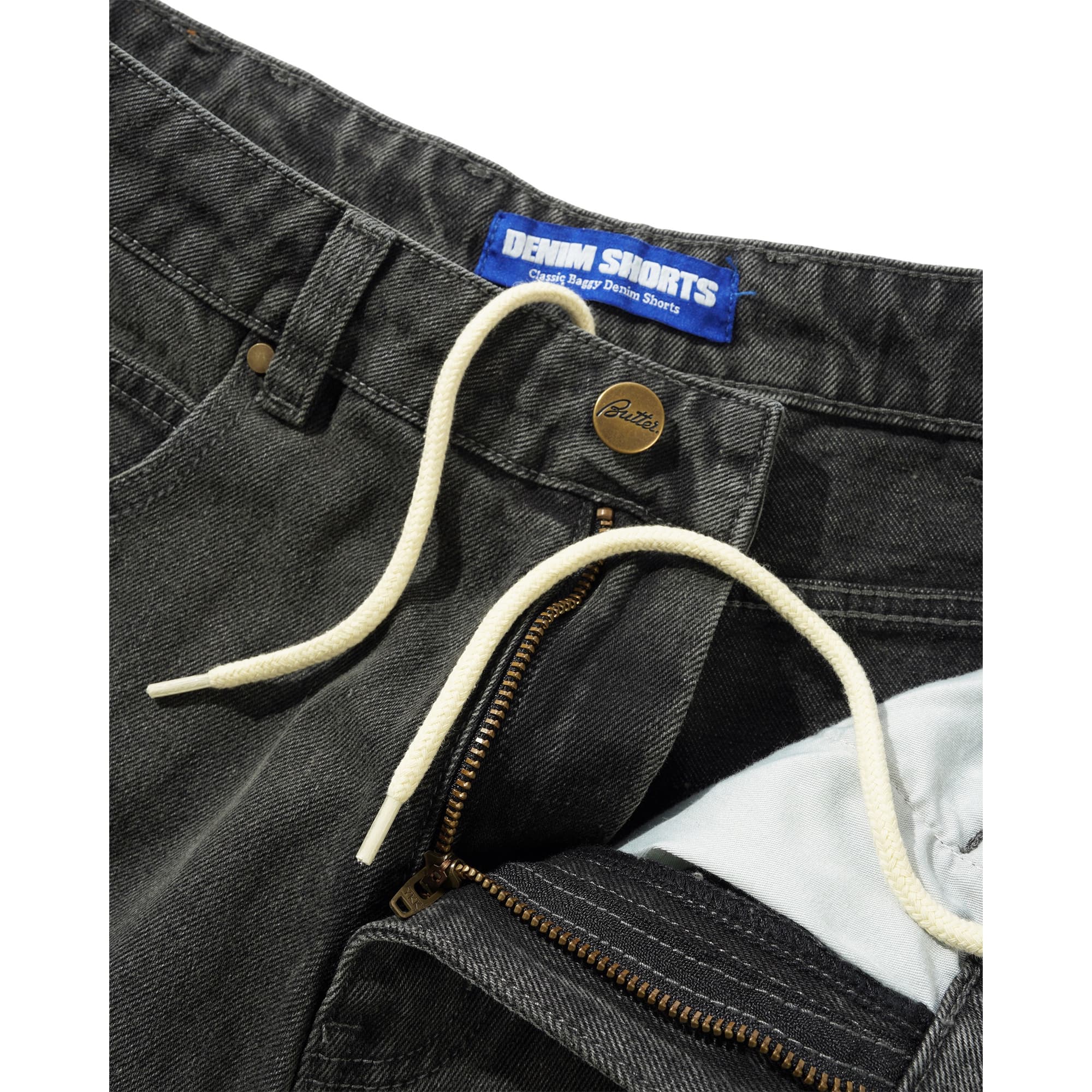 https://admin.plaze-shop.de/wp-content/uploads/2026/02/scorpion_stitch_denim_short_slub_black_buttergoods_plaze_skateshop-5.jpg